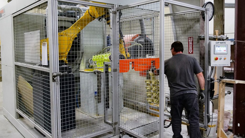 Dipping: operator loading Dip Mate robotic dipping cell