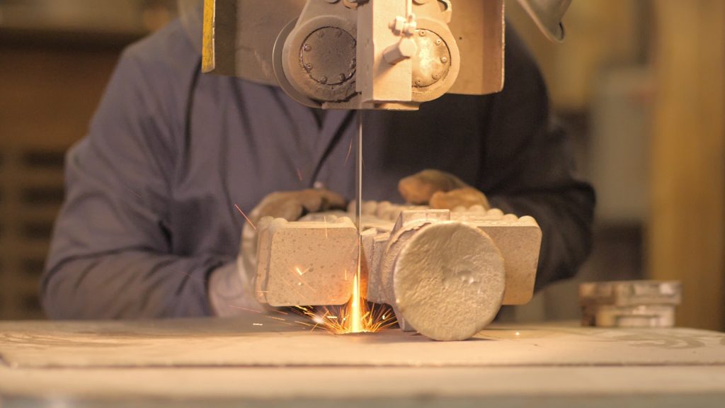 Finishing: friction bandsaw cutoff